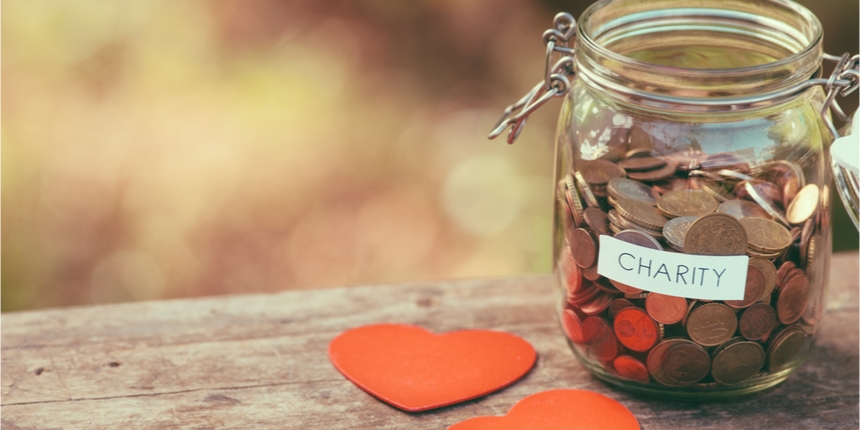Charity jar filled with coins