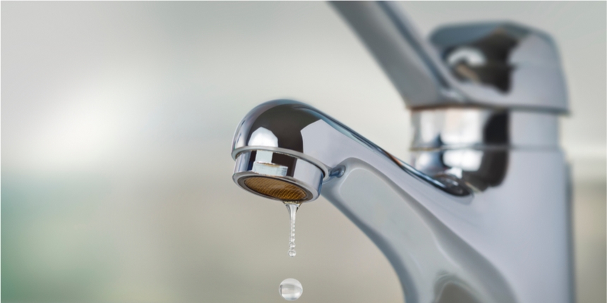 Close up of dripping silver tap