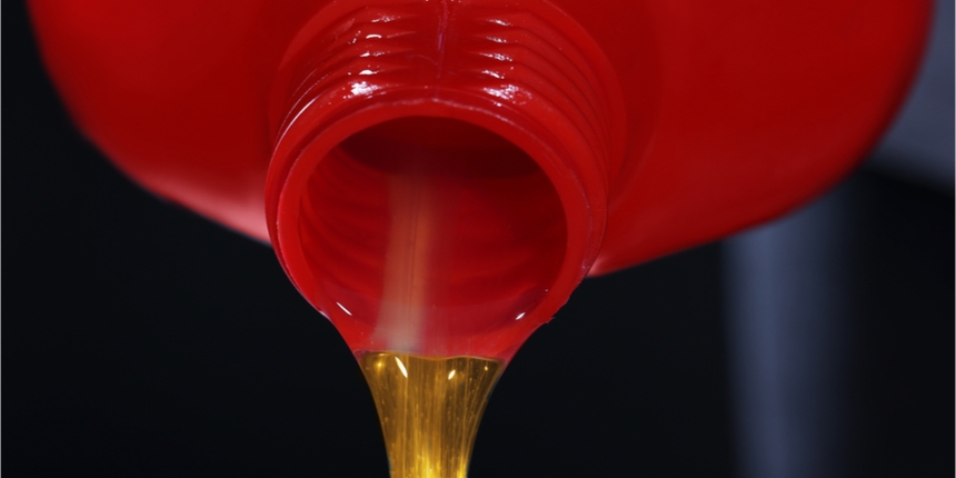 Close up of oil being poured from a bottle